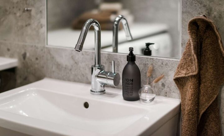 Close up of bathroom sink with mirror